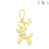 Xenos Selutelhangers-Sleutelhanger hond met parelketting - plastic - 6.5x6.5x1 cm - diverse varianten